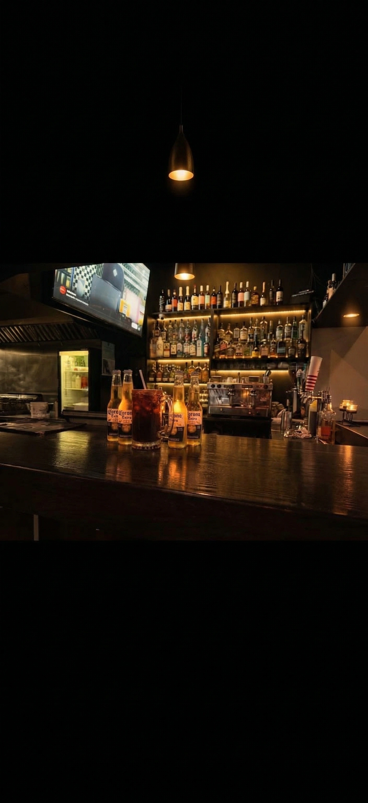 Freddy's gold-lit bar with handcrafted cocktails
